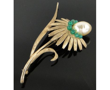 A silver gilt floral spray brooch,
set with large pearl and green stones, length 8.5cm.