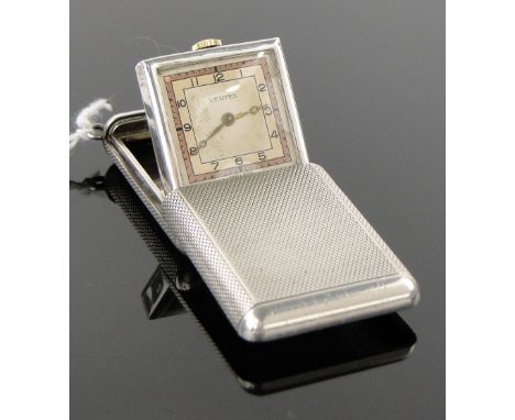 A Vertex silver cased travelling timepiece,
circa 1930 in engine turned case, case length closed 40mm.