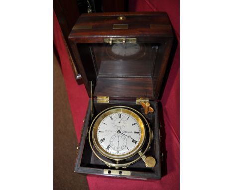 A brass ships gimbolled chronometer, 
signed Richard Hornby, Liverpool, in original mahogany and brass mounted travelling cas