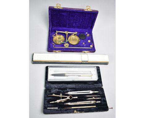 A Cased Drawing Set, a Cased Parker Pen, a Cased Slide Rule and a Cased Set of Pan Scales
