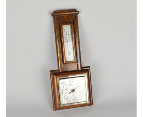 A Mid Century Oak Framed Aneroid Barometer