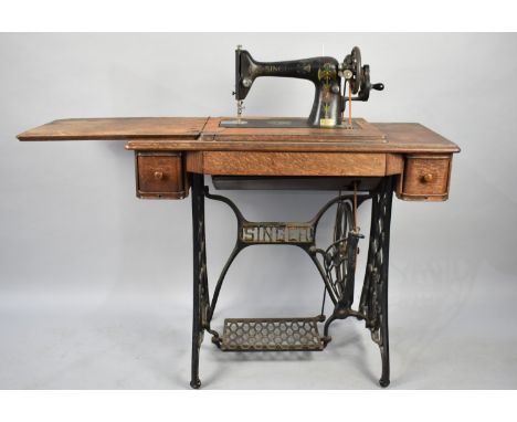 An Early 20th Century Treadle Singer Sewing Machine Number F8842584, Some Attention to Water Damaged Timber required