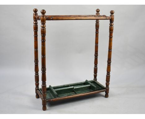 An Edwardian Twelve Division Stick Stand with Removable Tray, 61cms Wide