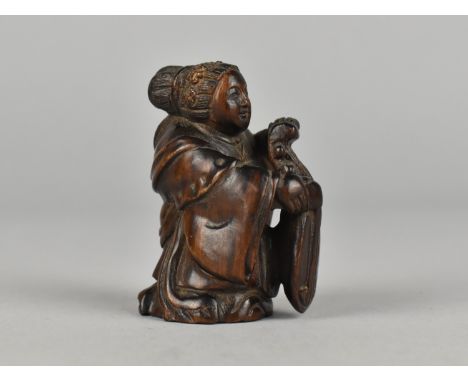 A Carved Wooden Netsuke Depicting Musician with Instrument, Signed to Base, 5.25cms High