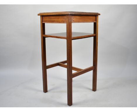 An Edwardian Mahogany Square Topped Stand with Stretcher Shelf, 41cms Square, 79cms High