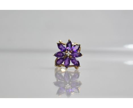 A 9ct Gold, Amethyst and Diamond Ladies Dress Ring, Central Small Round Cut Diamond with Marquise Cut Amethyst Surround, Size