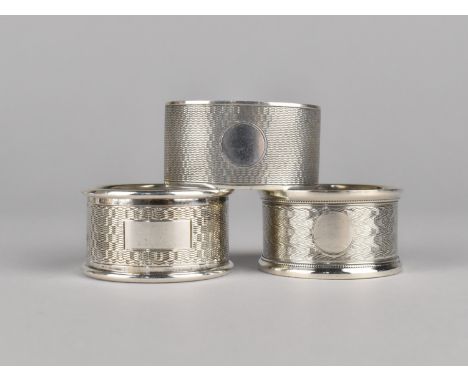 Three Various Silver Napkin Rings with Engine Turned Decoration, 74g