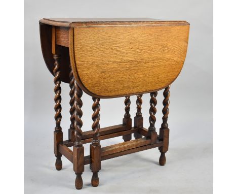 A Mid 20th Century Oak Barley Twist Drop Leaf Oval Topped Gate Leg Table, 60cms Long
