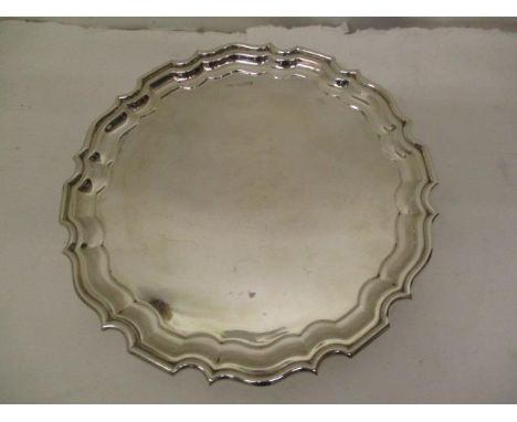 A 1940s silver waiter by Walker &amp; Hall, Sheffield 1948 with a Chippendale edge on scrolled feet, 8" dia, 328g 