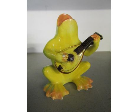 Delphin Massier for Vallauris Pottery, a French faience model of a singing frog playing the mandolin, circa 1900, signed to t