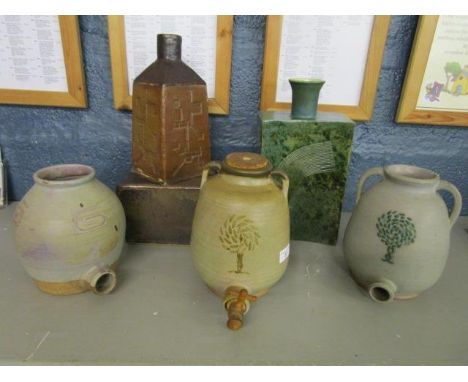 Murial Caley - a group of 1960s studio pottery barrels, a table lamp and a rectangular section bottle vase, most with incised