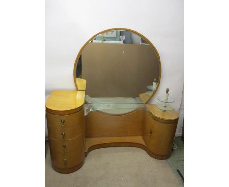 Betty Joel 1894-1985 Token Works, a satinwood and cross banded dressing table with a round mirror and a curved inverted plint