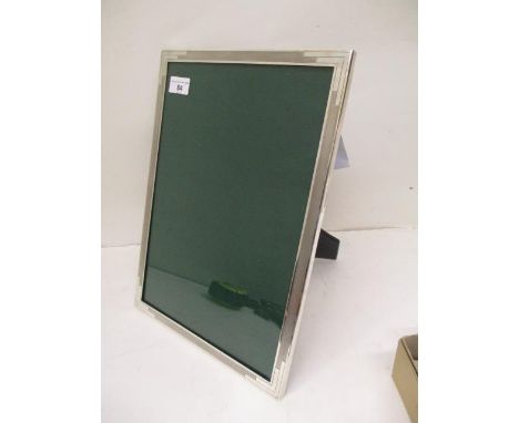 A modern Art Deco style silver photograph frame by Sanders &amp; Mackenzie, Birmingham 1964 with engine turned decoration on 