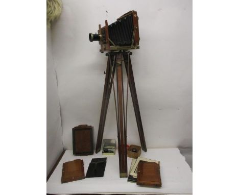 A Thornton Pickard The NB No 4 mahogany cased plate camera with an Ashfords patent tripod, an additional lens and accessories