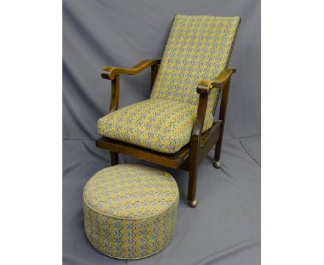 AN ADJUSTABLE RETRO STYLE WOODEN ARMED CHAIR with pouffe stool. 