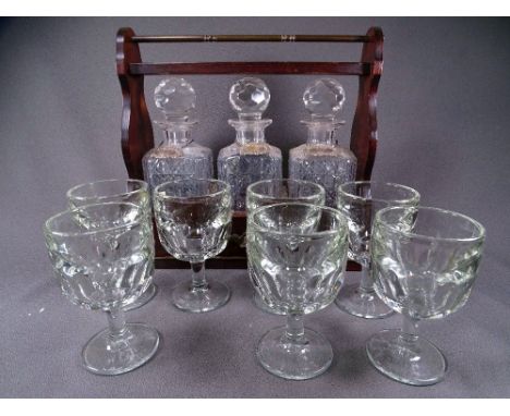 TANTALUS. Of 3 square hobnail cut decanters each with Gin, Whisky and Brandy collars and 6 heavy pressed glass wine or beer g