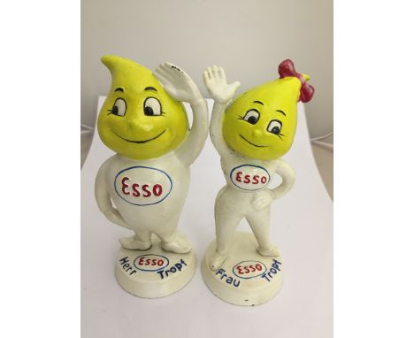 A pair of cast metal Esso money boxes