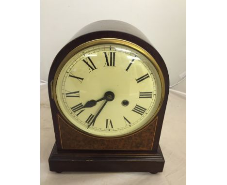 A 19th century mahogany enamel-faced mantel clock