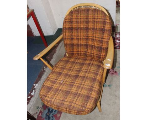 A pair of Ercol beech armchairs each with loose cushions 