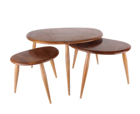 A set of three Ercol elm footstools