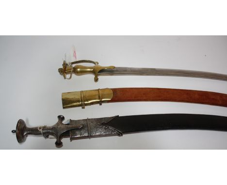 An antique Indian Tulwar design sword with chased silver metal pommel and silver mounted leather scabbard, (sword firmly stuc
