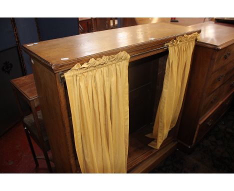 An Edwardian light oak open bookcase 106cm wide 