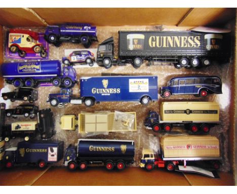 THIRTY-FOUR ASSORTED DIECAST MODEL COMMERCIAL VEHICLES  by Corgi and others, including those of Guinness, Cadburys, and Miche