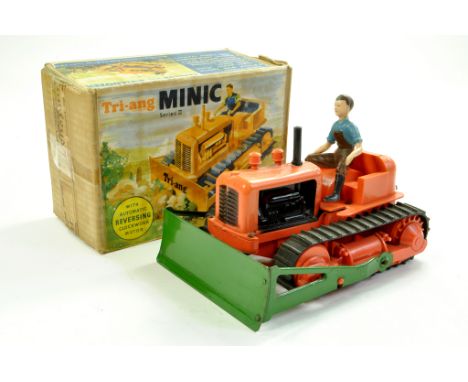 Triang Minic larger scale Crawler Tractor Bulldozer in orange black plastic, green metal dozer blade with driver figure. A su