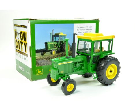 Ertl 1/16 John Deere 4320 Tractor for 2005 Plow City Farm Toy Show. Superb piece is excellent with excellent box.  Enhanced C