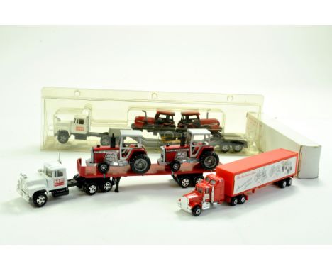 Ertl 1/64 Trucks of the World Series issues comprising Mack Flatbed with Case Tractor Models, another with Massey Ferguson an