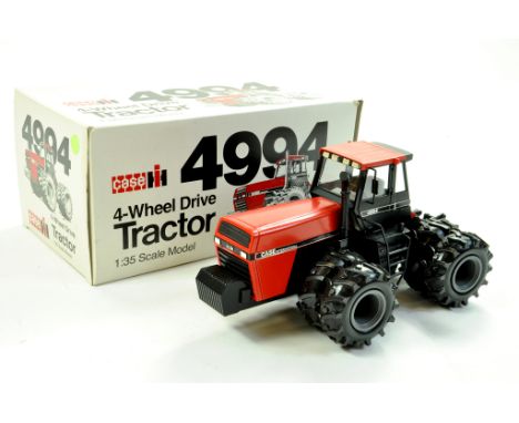 Conrad 1/35 Farm issue comprising Case 4994 All Wheel Steer Tractor. Excellent with very good to excellent original box. Supe