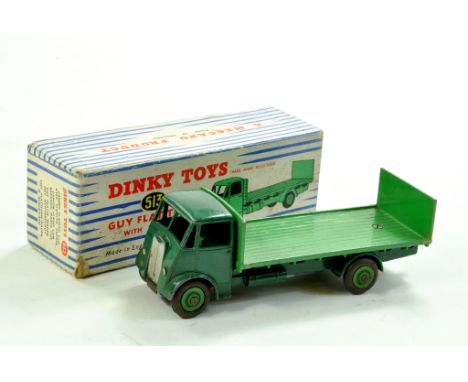 Dinky No. 513 Guy Flat Truck with Tailboard with dark green cab and chassis plus lighter green back. Good to very good in goo