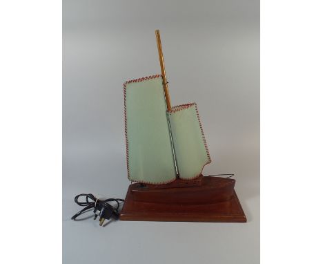 A Novelty Wooden Table Lamp in the Form of a Sailing Boat, 52cm High
