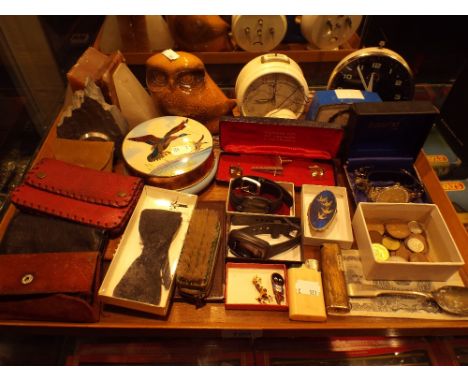 A Tray of Curios to Include Robertsons Golly Enamelled Badge,Wrist Watches, Cuff Links, Bank Notes, Alarm Clock Etc
