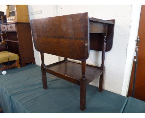 An Oak Drop Leaf Trolley with Stretcher Shelf