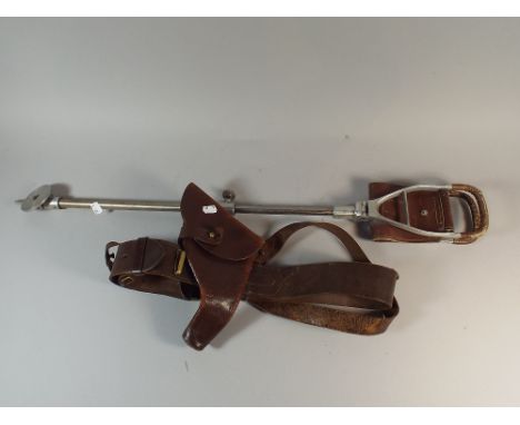 A Leather Sam Brown Holster and a Shooting Stick