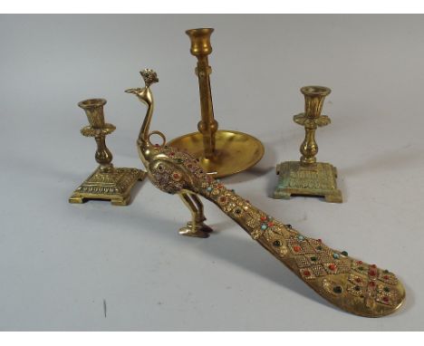 A Pair of Brass Candlesticks, 12cm high, a Gimballed Brass Bedchamber Stick and a Jewelled Brass Model of a Peacock