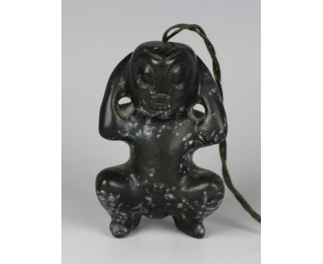 A pre-Columbian Mayan style carved black hardstone figure of a squatting male, length 6cm. Provenance: from the estate of a W