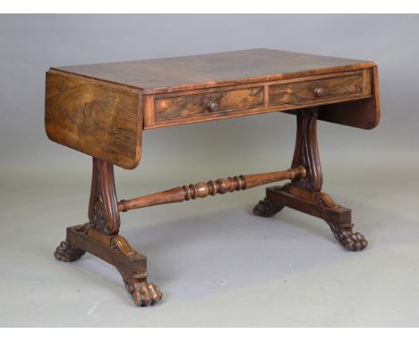 A fine Regency rosewood sofa table, in the manner of Gillows of Lancaster, fitted with two oak-lined drawers above foliate ly