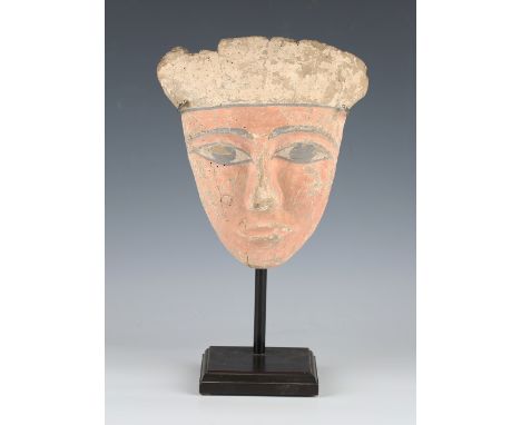 An Egyptian carved wooden funerary mask, possibly Late period, 664-332 BC, the face with painted gesso surface of pale pink a
