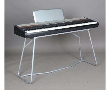 A Korg SP-250 electric keyboard, width 130cm, together with stand and pedal.Buyer’s Premium 29.4% (including VAT @ 20%) of th