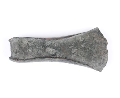 A British Bronze Age early form axe head with flanged sides, length 11.7cm.Buyer’s Premium 29.4% (including VAT @ 20%) of the
