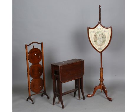 An early 20th century mahogany polescreen, inset with a silk and chenille panel of a girl, height 139cm, together with an Edw