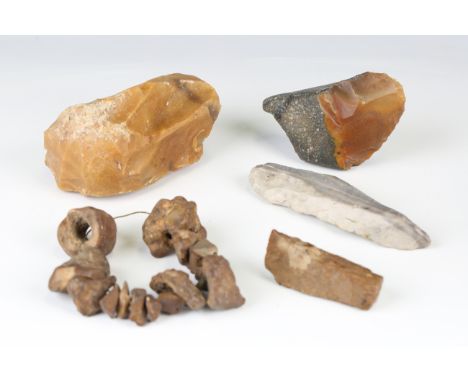 A small group of Stone Age objects, including a Presigny core, length 13cm, various blades and a small polished stone axe, le