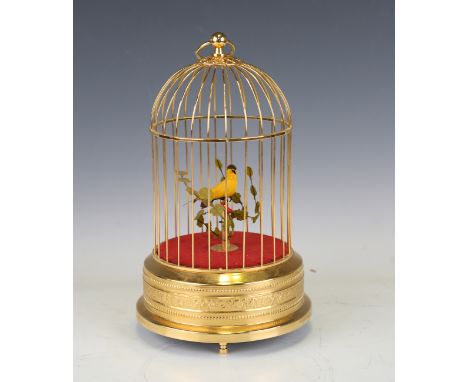 A modern gilt brass automaton musical birdcage and bird, height 27cm, diameter 16cm.Buyer’s Premium 29.4% (including VAT @ 20