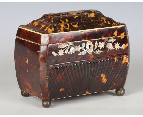 A Regency tortoiseshell tea caddy of curved sarcophagus form, with ivory stringing and mother-of-pearl foliate inlay above a 