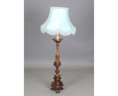 A 19th century French walnut table lamp of acanthus carved form, on a triform base, height 92cm, fitted with a shade.Buyer’s 