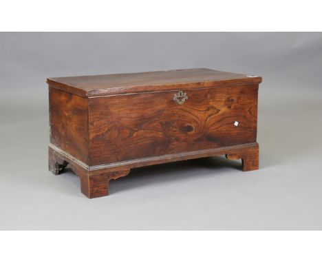 A 19th century provincial elm trunk, the hinged lid enclosing a candlebox, height 43cm, width 88cm, depth 45cm.Buyer’s Premiu