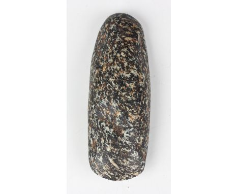 A pre-Columbian carved and mottled hardstone axe head, possibly Mayan, bearing collector's label, length 16cm. Provenance: fr