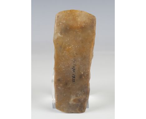 A Danish Neolithic polished stone axe head, detailed '...1933', length 14cm.Buyer’s Premium 29.4% (including VAT @ 20%) of th